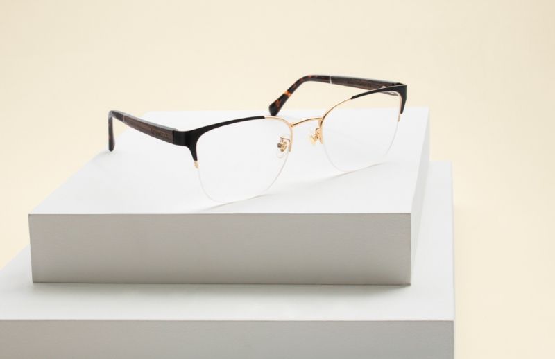 flat lay photo of Enchanted Gold eyeglasses from Kraywoods low bridge glasses collection