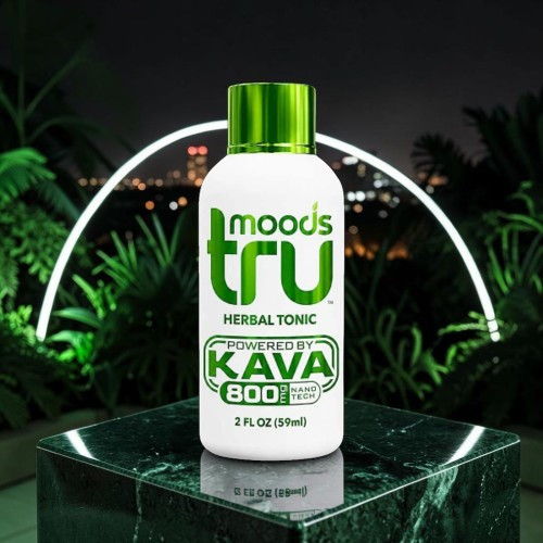 Bottle of herbal tonic Kava 800 on a dark background with lights.
