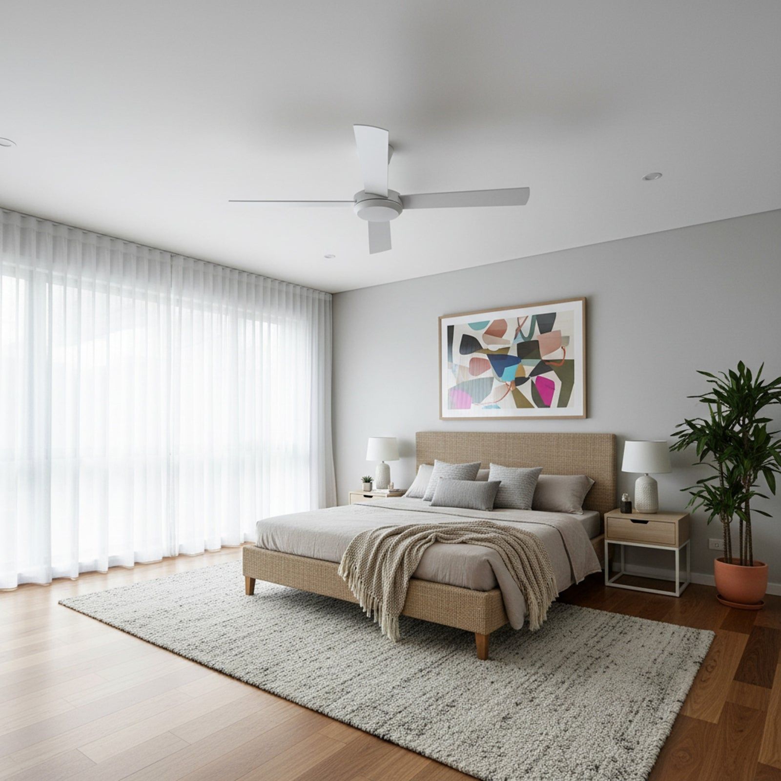 Modern bedroom with a bed, art, plants, and large windows.