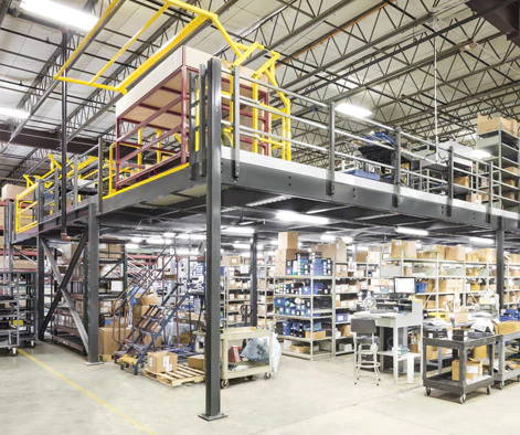 Single story Cogan mezzanine with safety pivot gate to allow pallets to be loaded on top of mezzanine.