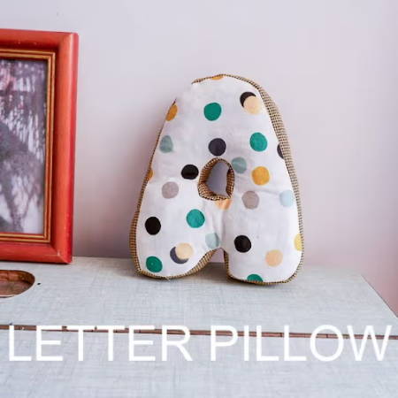 A little pillow in the shape of the letter A