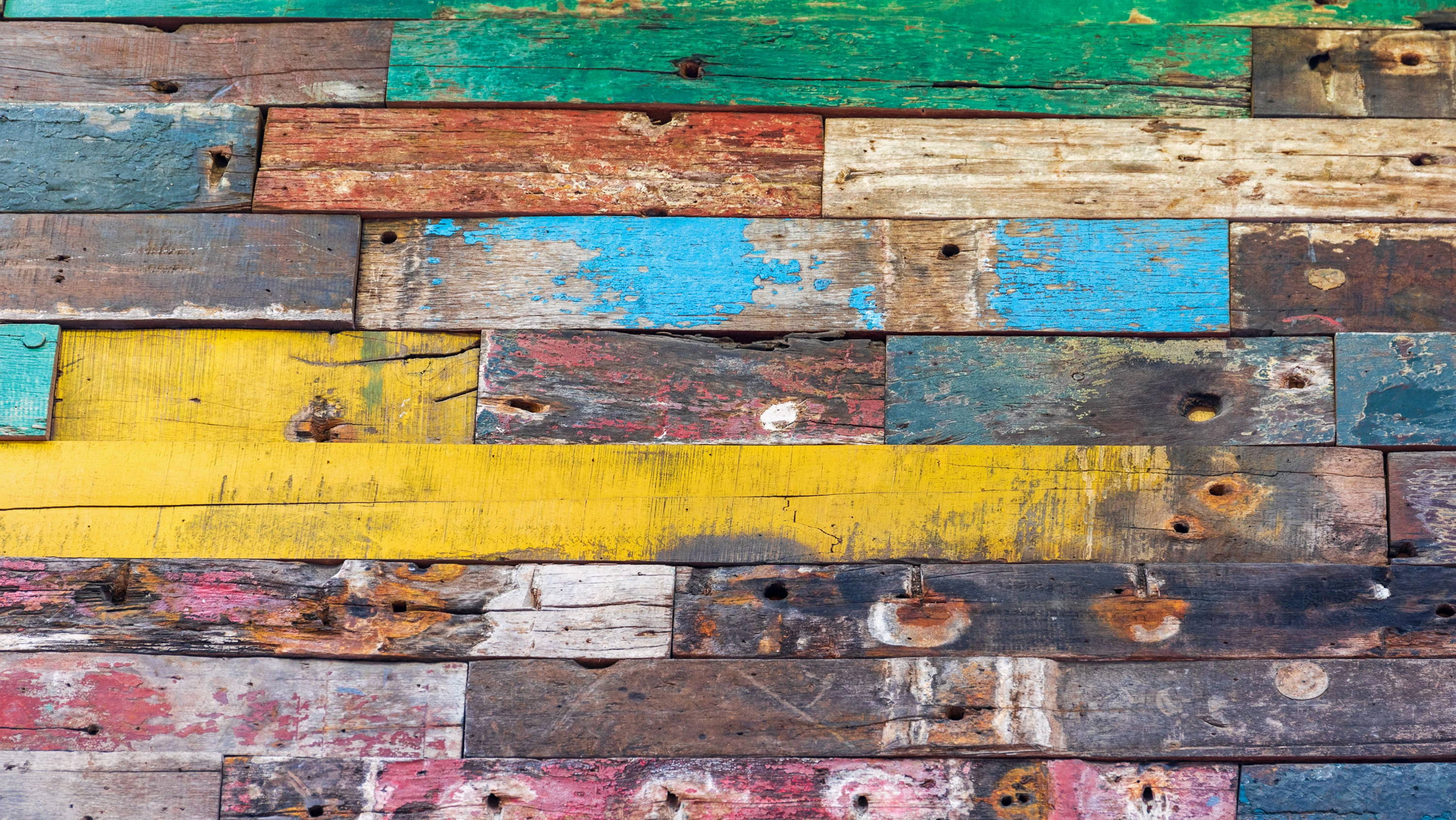 multicolored knotty wood wall