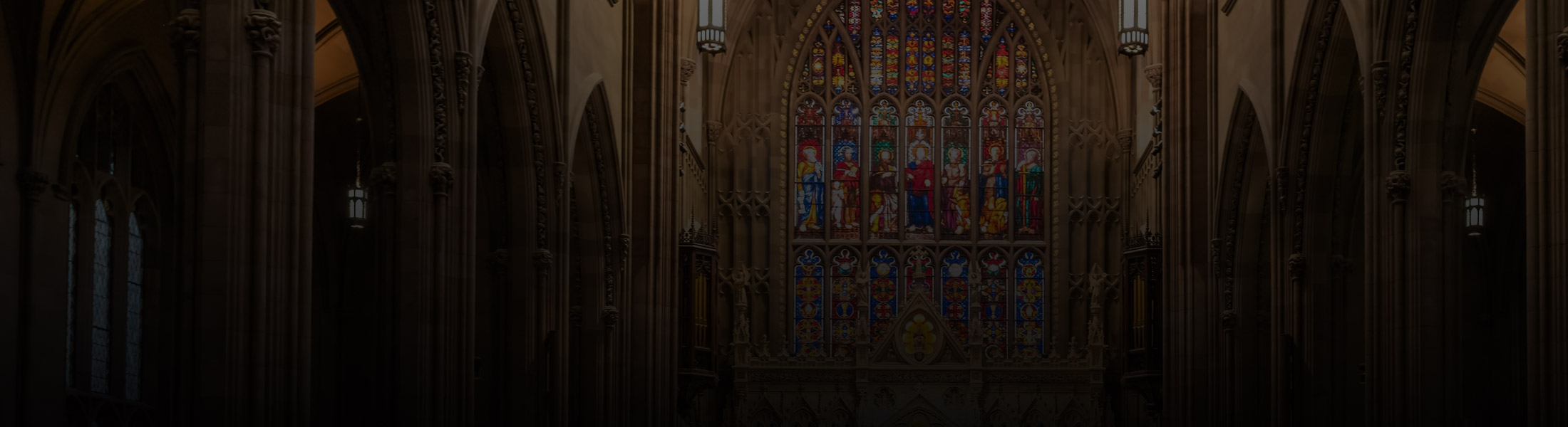 Church interior with stained glass windows and vaulted ceilings, representing security and monitoring solutions for faith-based organizations