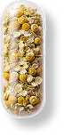 Transparent capsule filled with dried chamomile flowers and herbs.