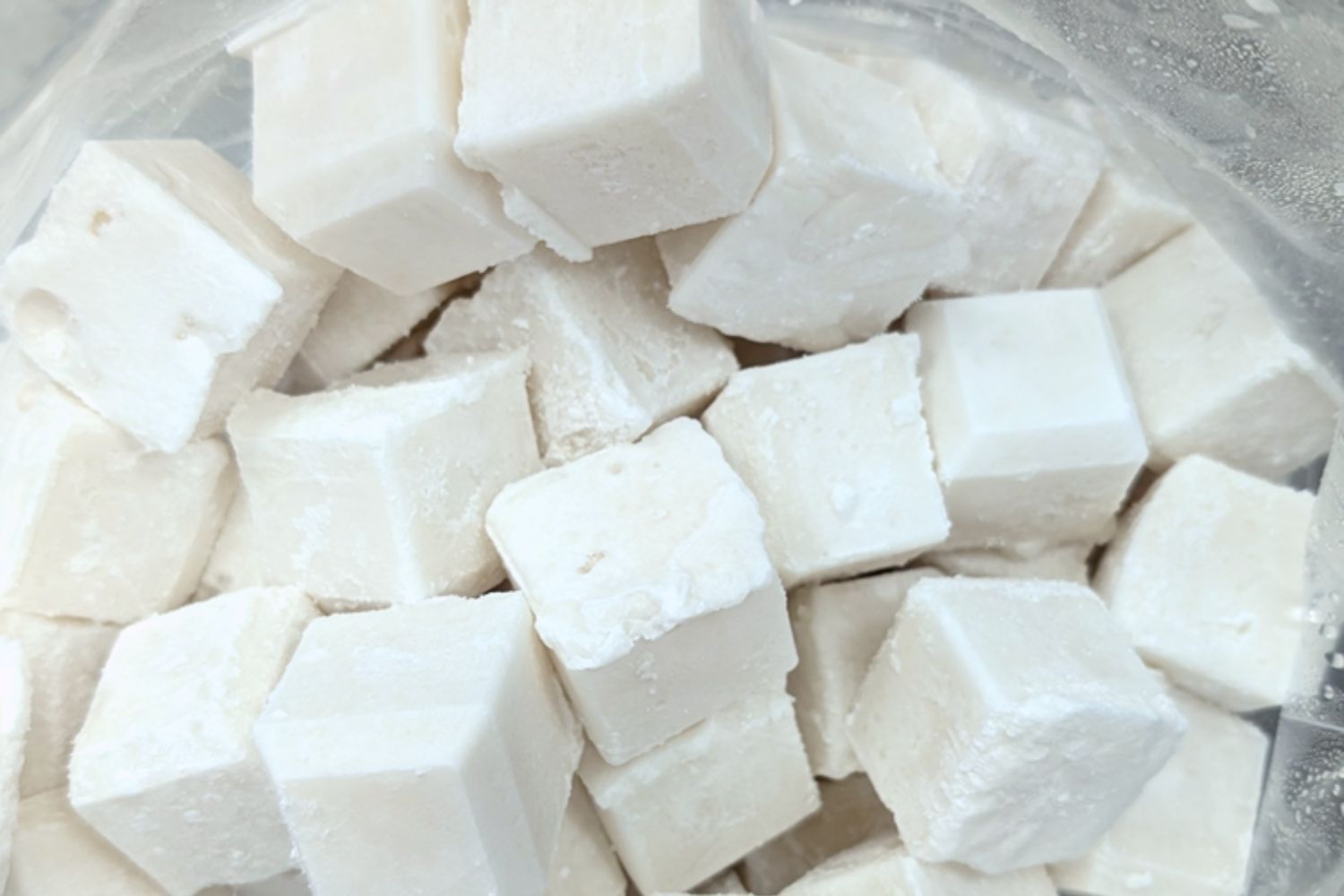 Cubes of white sugar in a clear plastic bag.