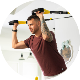 Man using suspension trainer
