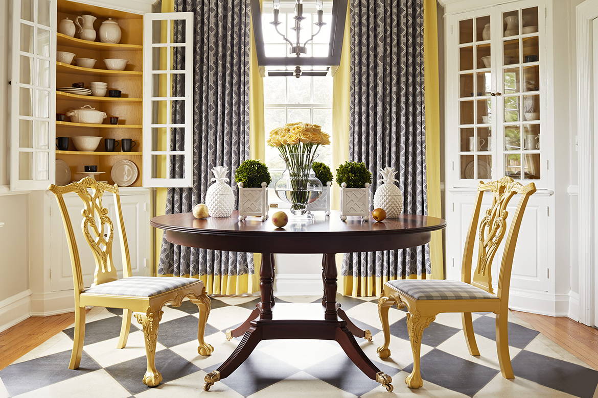 Picture of an interior dining room scene with Williamsburg brand yellow paint, custom furniture, and home accents