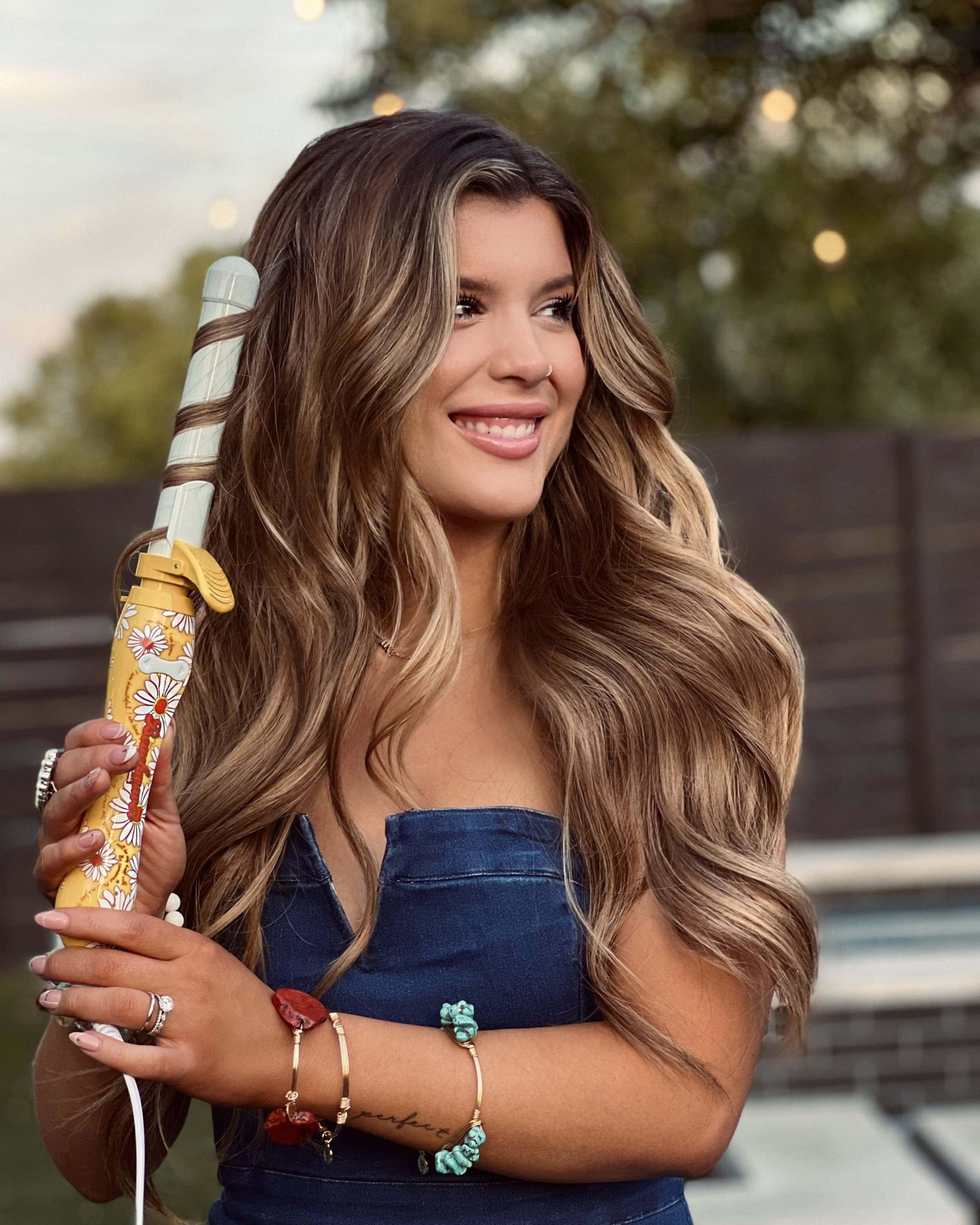 Image of Cassidy with the Classically You Collection beach waver in her hair