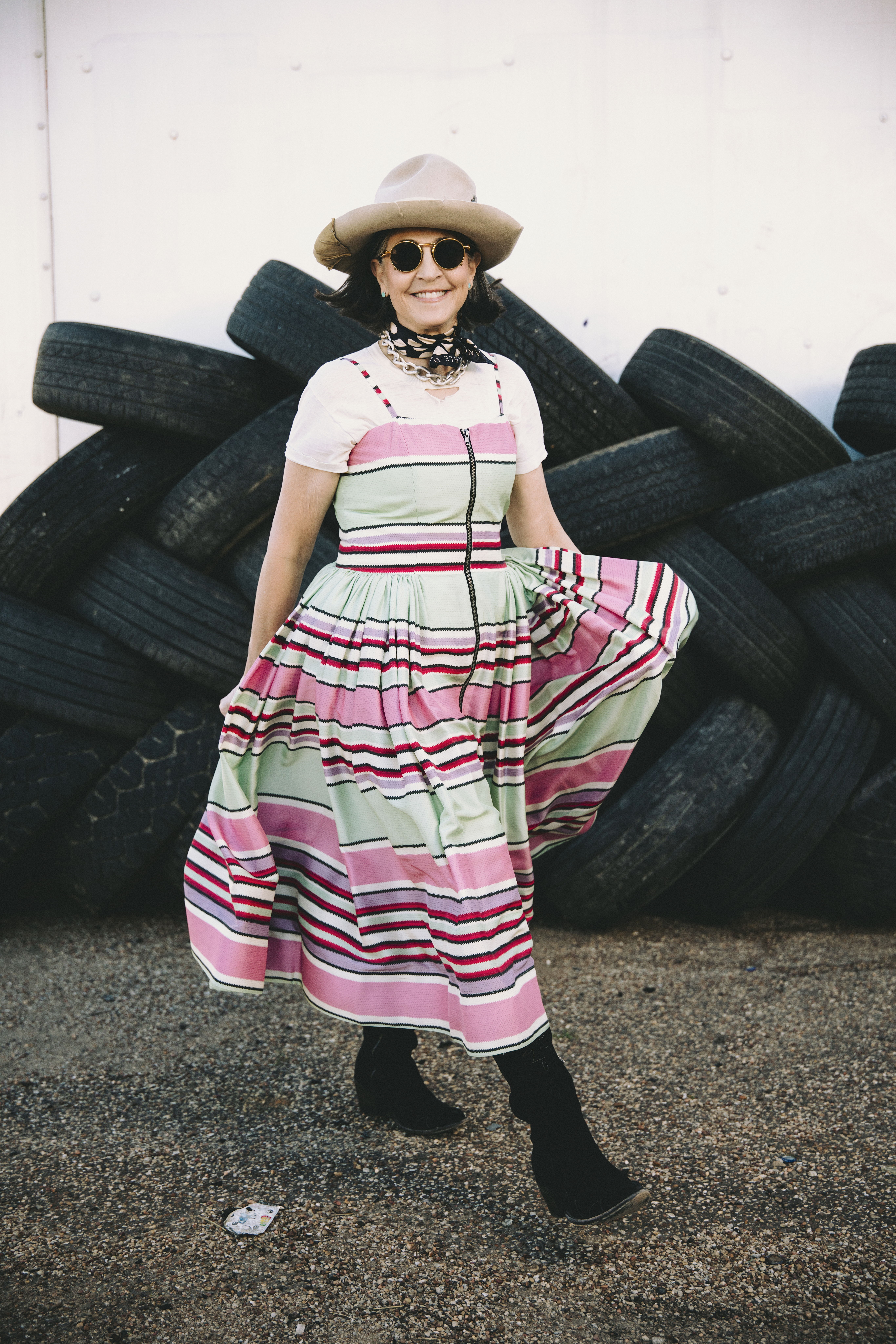 Cheryl wearing the Round Top Serape Dress with a white tee paired with Double D Ranch jewelry, accessories, and her Long Tall Sally boots.