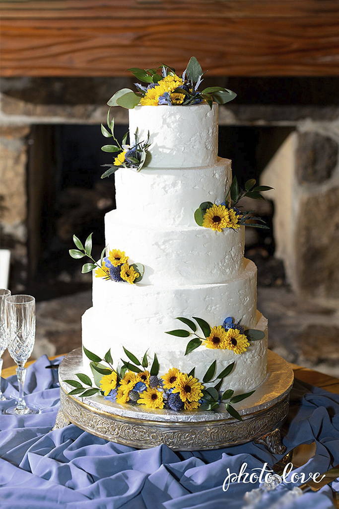 Wedding Cake with Yellow and Purple flowers