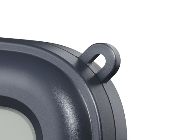 Close-up of a gray object with a loop attachment.