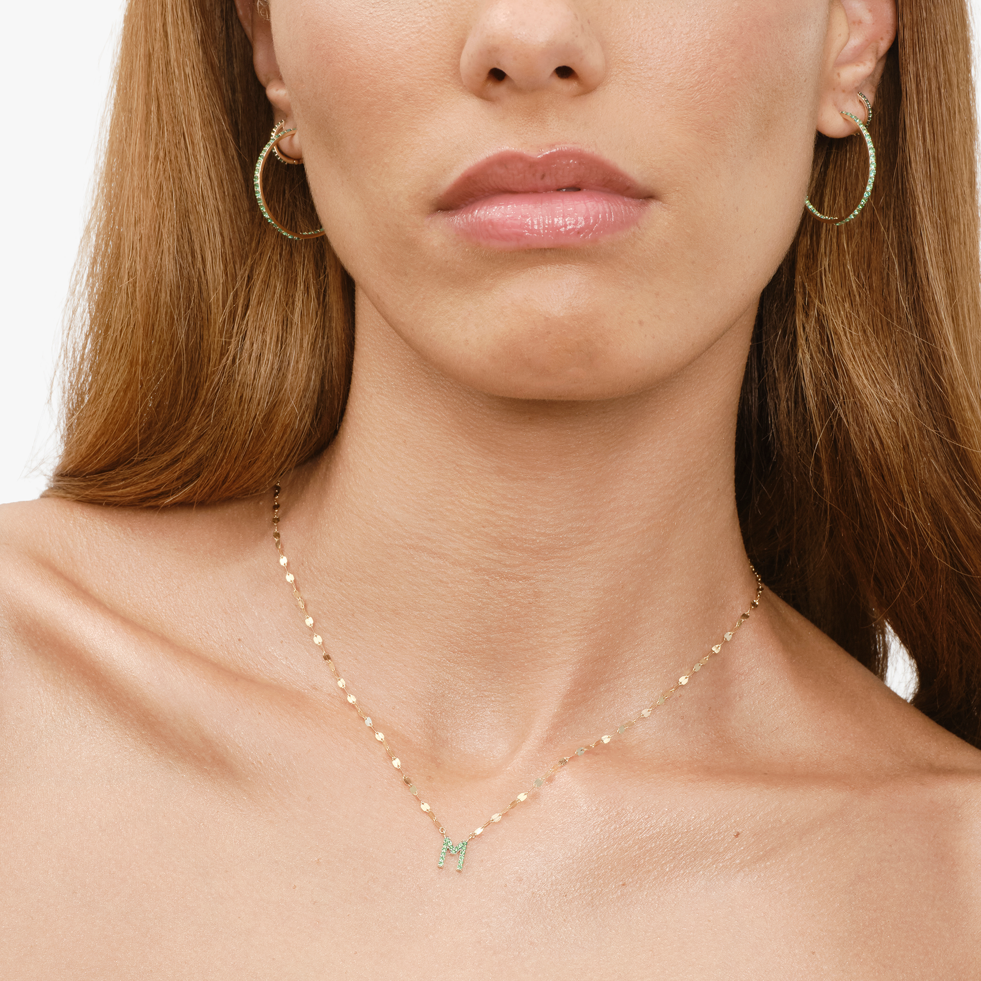 Gold chain necklace with a Y-shaped design.