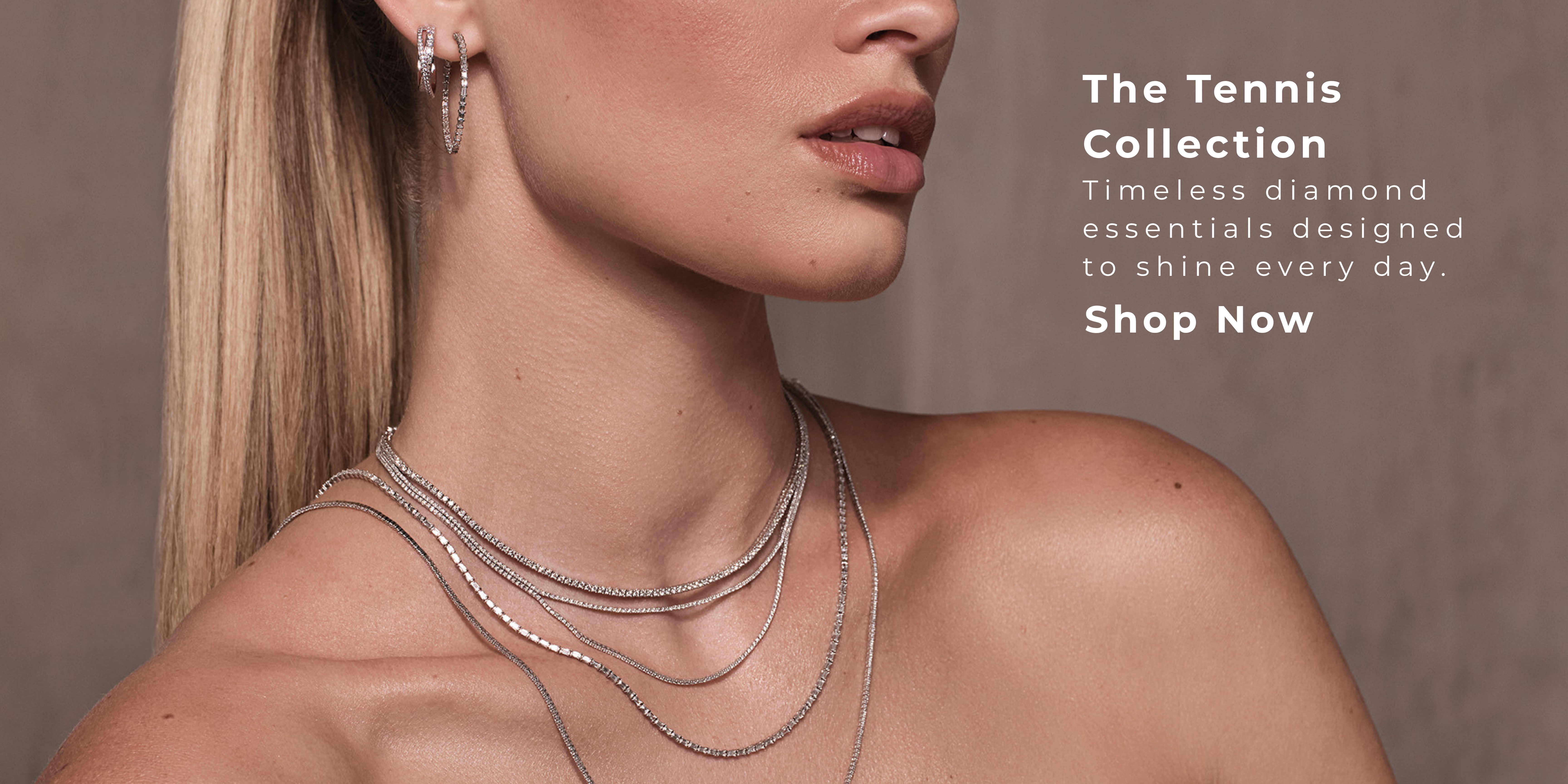 Close-up of a model wearing layered diamond tennis necklaces and matching diamond hoop earrings against a neutral background. White promotional text reads: 