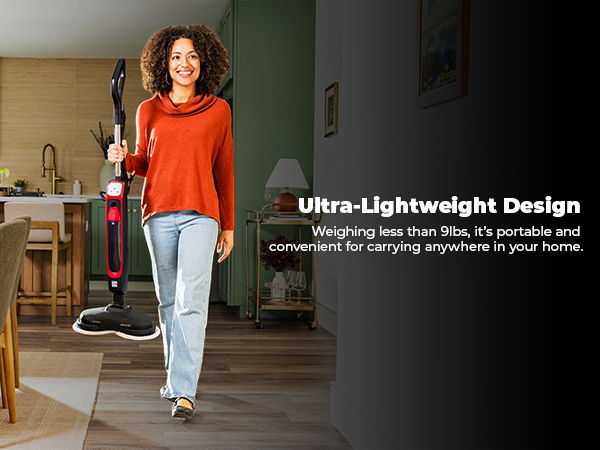 Woman carrying a steam cleaner by the handle, highlighting the ultra-lightweight design
