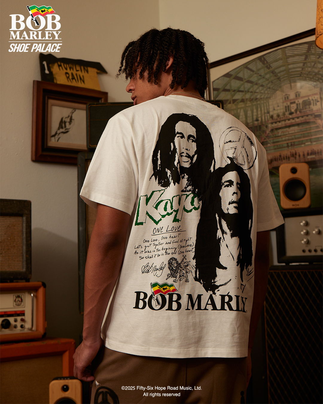Person wearing a Bob Marley t-shirt, facing away from the camera.