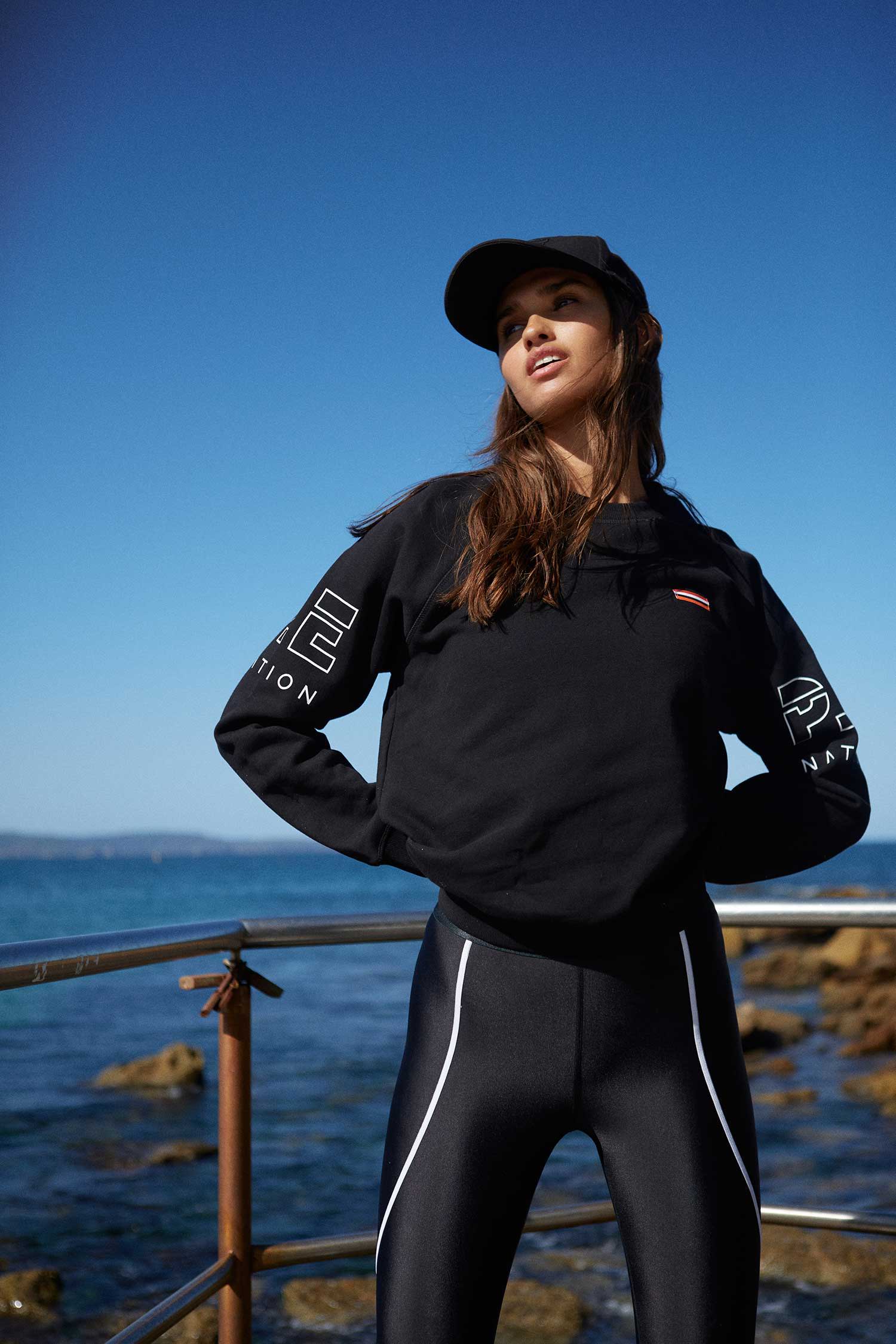 Girl standing in the sunshine wearing activewear