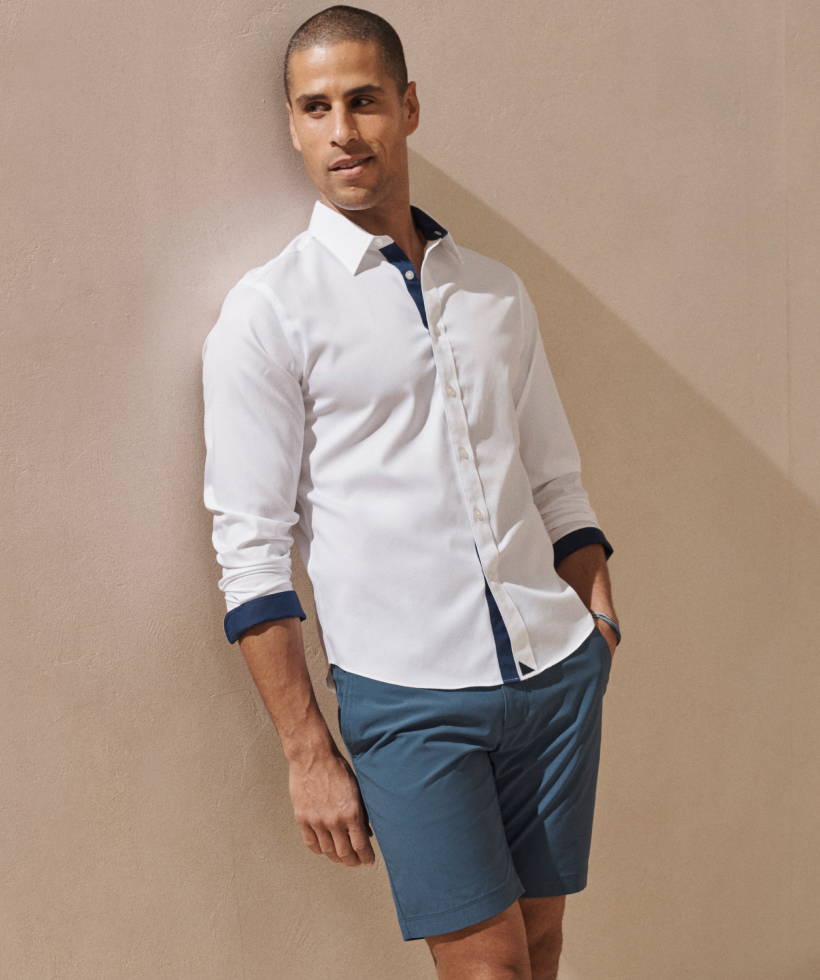 Model wearing white wrinkle-free UNTUCKit Las Cases Special Shirt