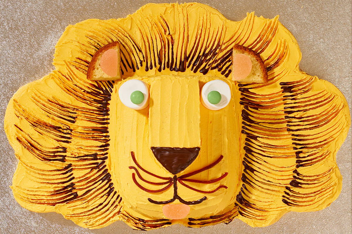 An image of a decorated Lion cake baked using Falcon Enamelware bakeware.