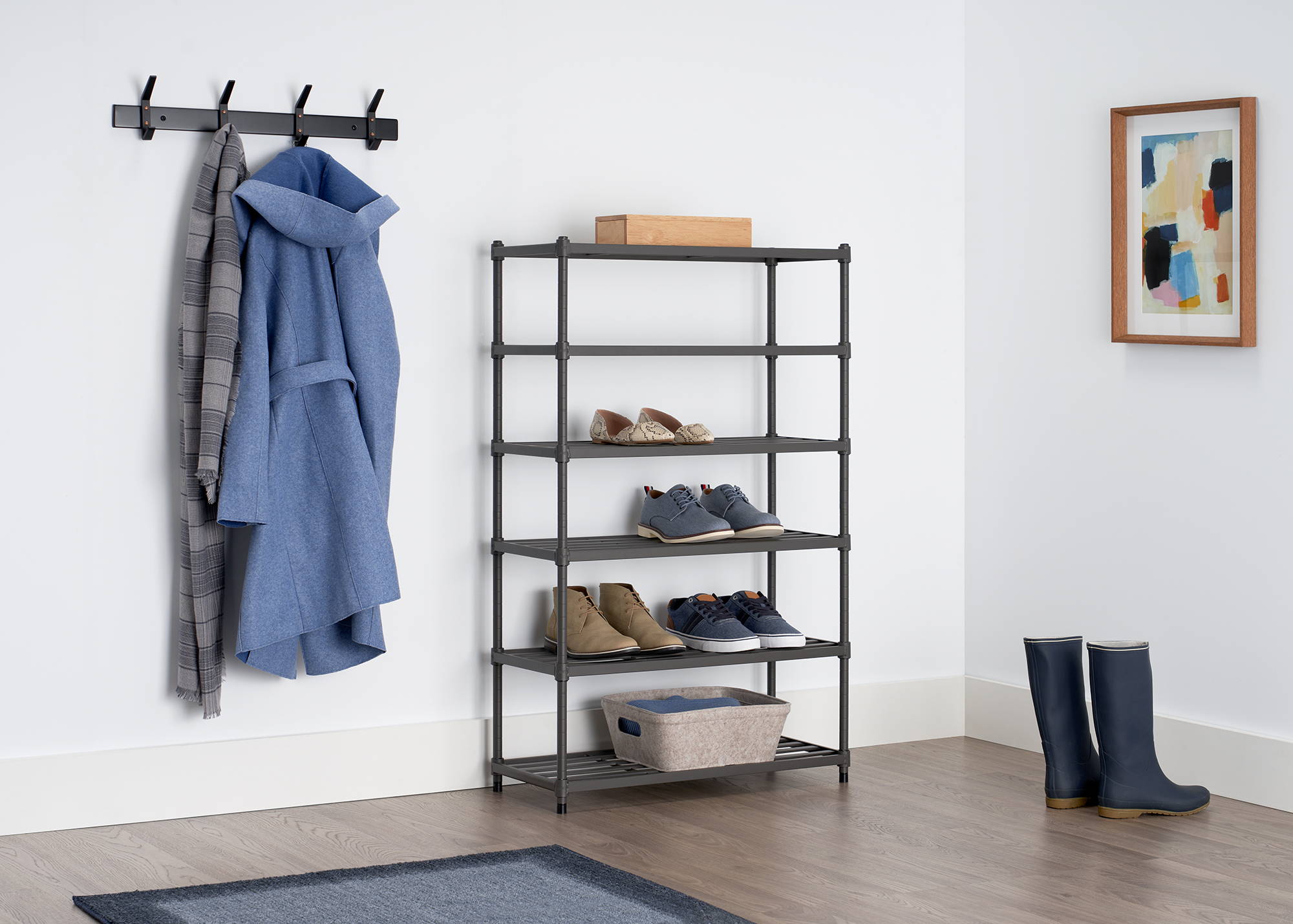 tall gray metal shoe rack in an entryway