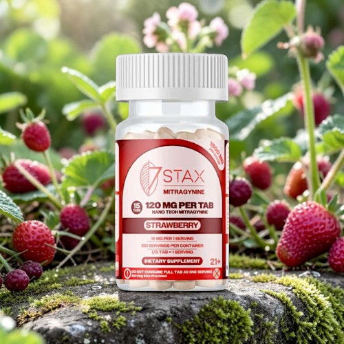 Bottle of dietary supplement surrounded by strawberries on a natural background.