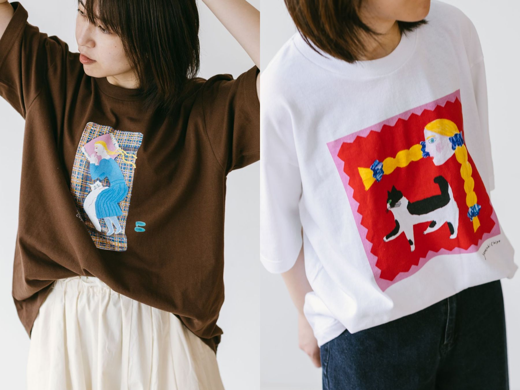 Two women wearing graphic t-shirts, one brown and one white.