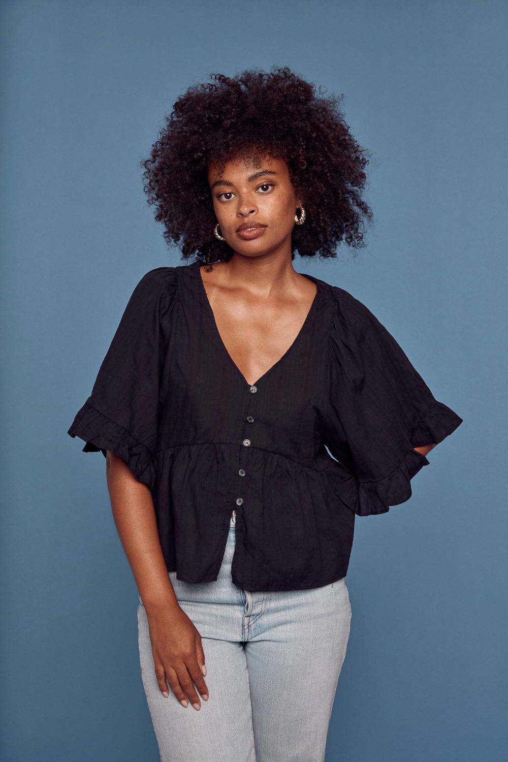 Trixxi Wholesale top link, girl in boho blouse ruffle sleeve top.