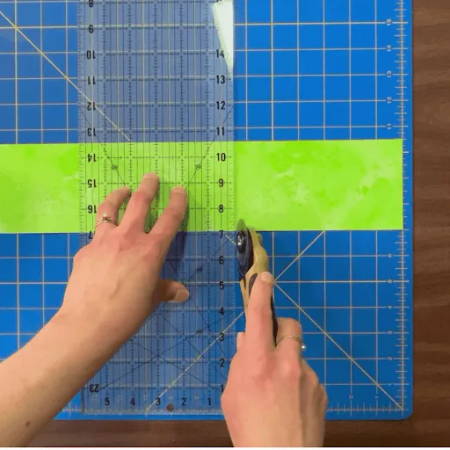 Cutting 3 ½” x 6 ½” rectangles from fabric strips