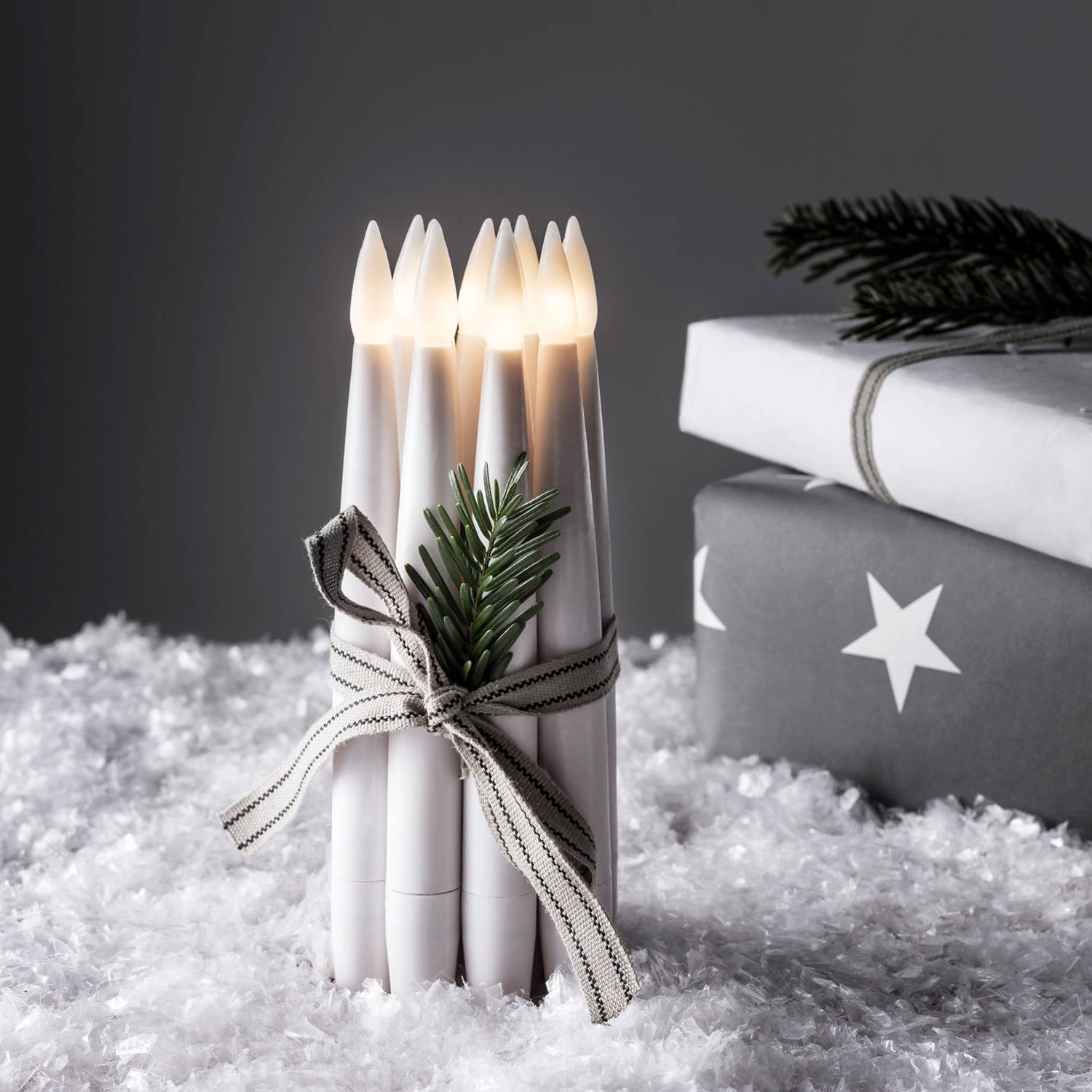 10 Mini Wax LED Taper Candles tied together with a bow