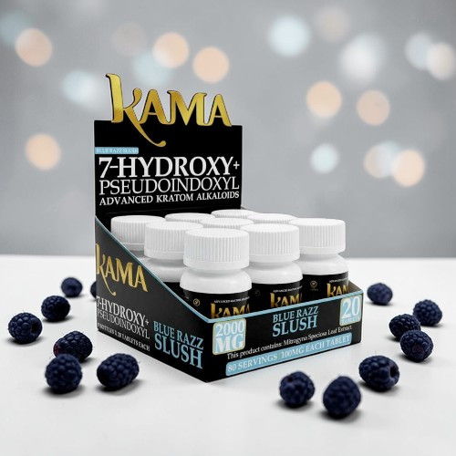 KAMA product display with bottles and raspberries on a blurred background.