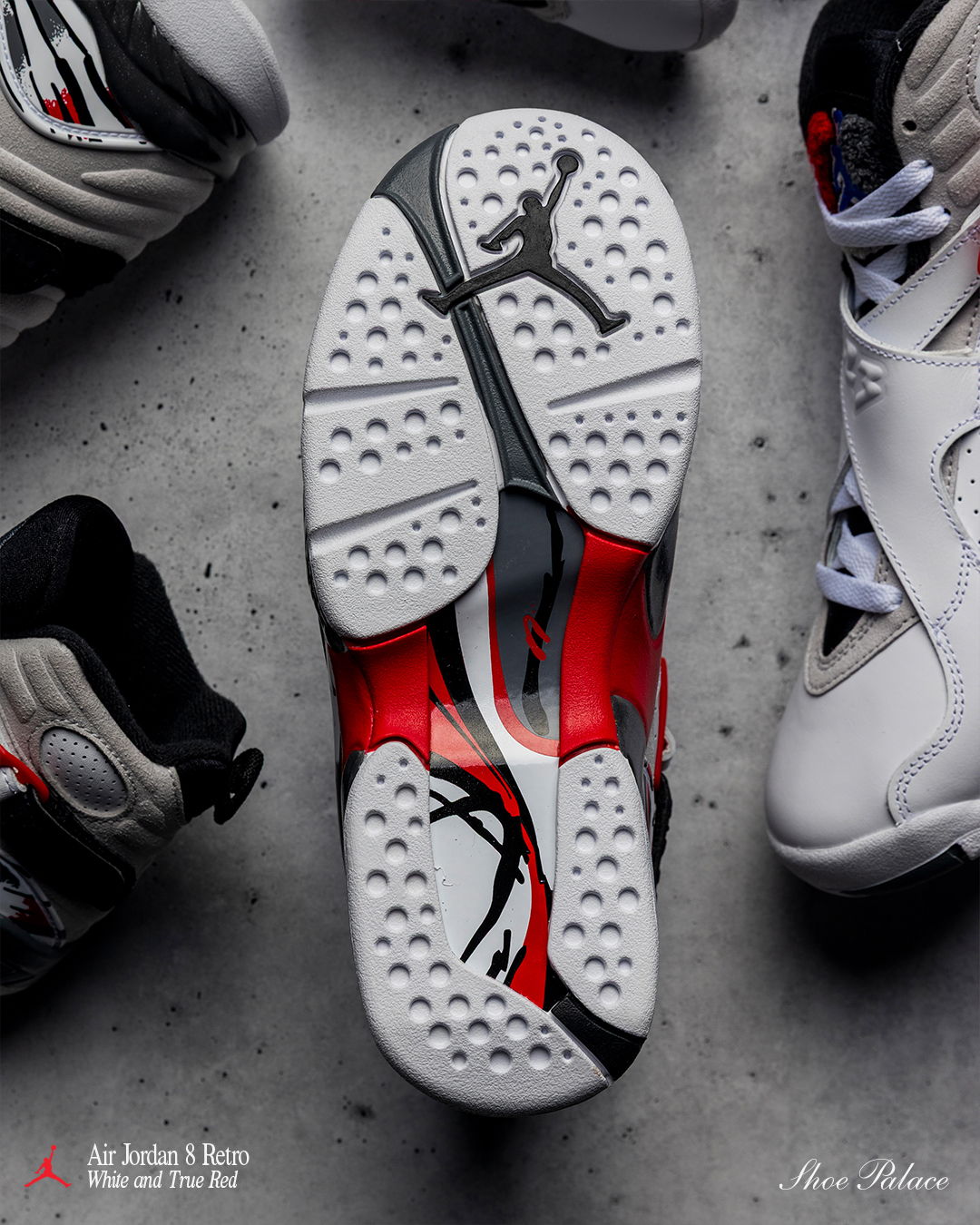 Air Jordan 8 Retro 'White And True Red' - Air Jordan sneakers displayed from above, showing the sole and colorful design.
