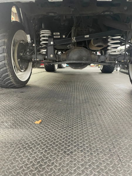 Underside rear suspension view beneath Addison's 2015 Chevy Tahoe, install photo 2