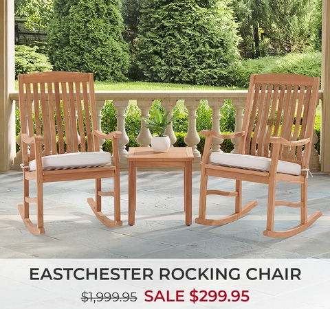 Eastchester rocking chair set with a table, on a porch with greenery.