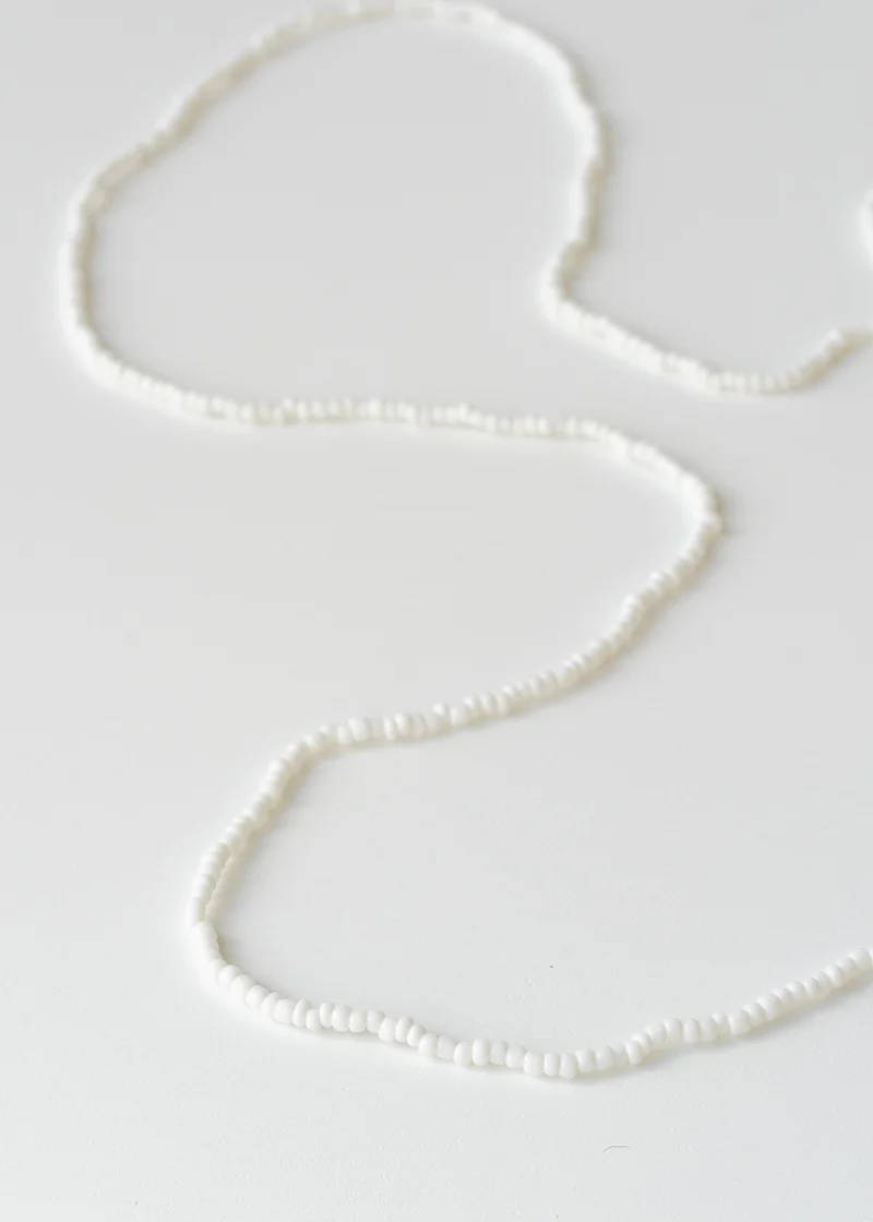 A necklace comprised of white, small beads
