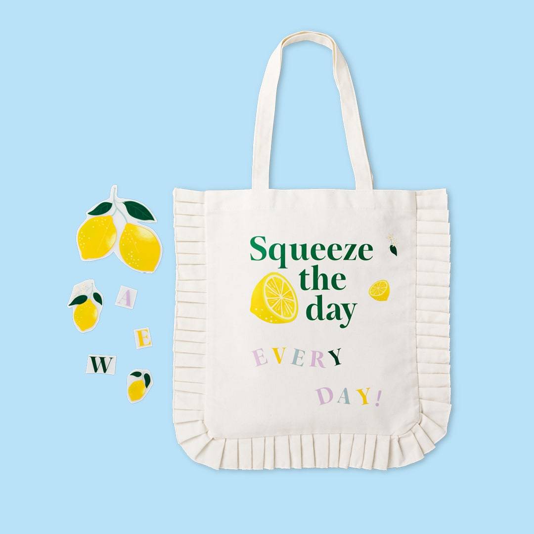 A canvas tote bag printed with the phrase 