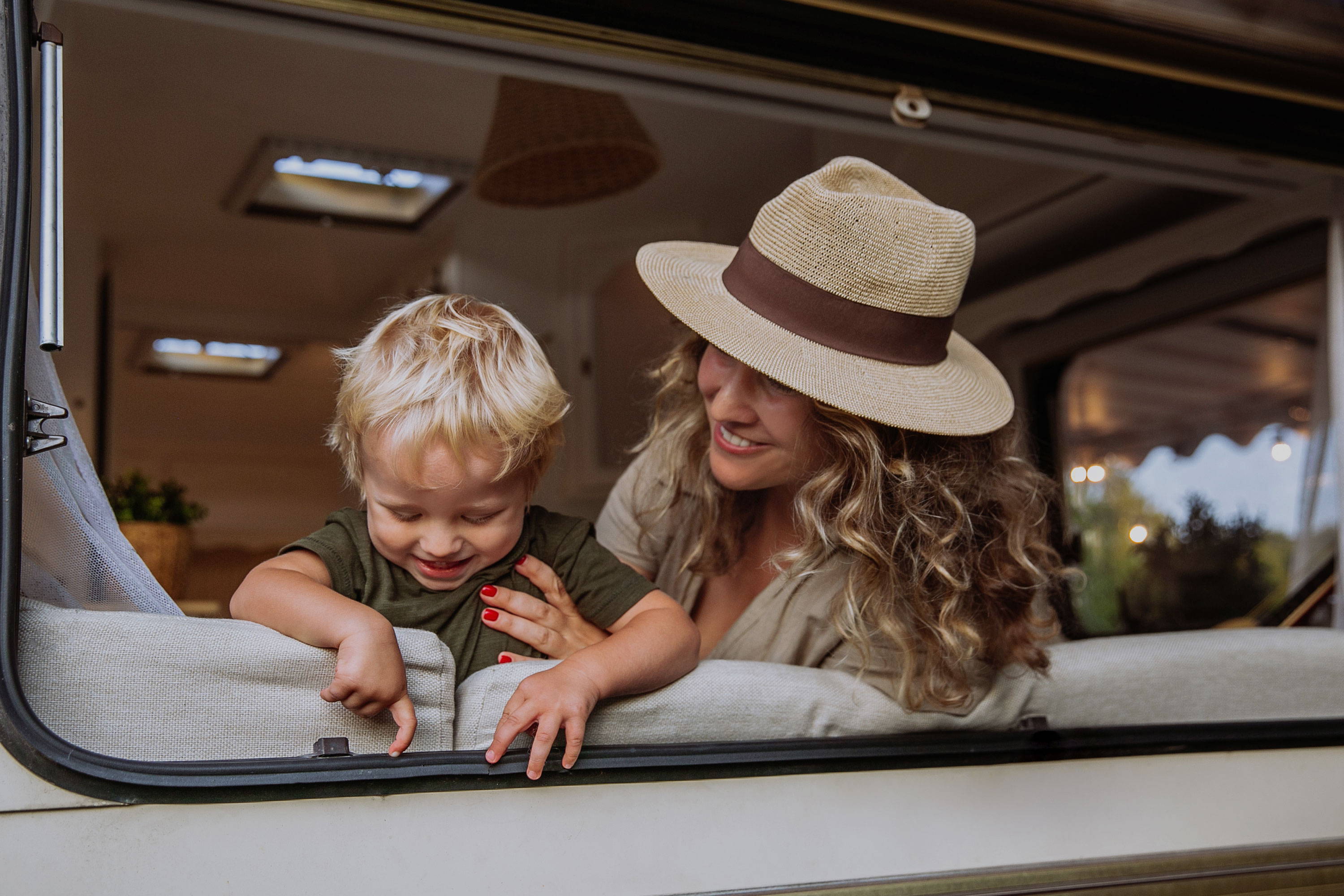 mother and child in RV smiling