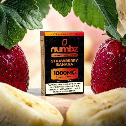 Box of Numbz Strawberry Banana with strawberries and banana slices surrounding it.
