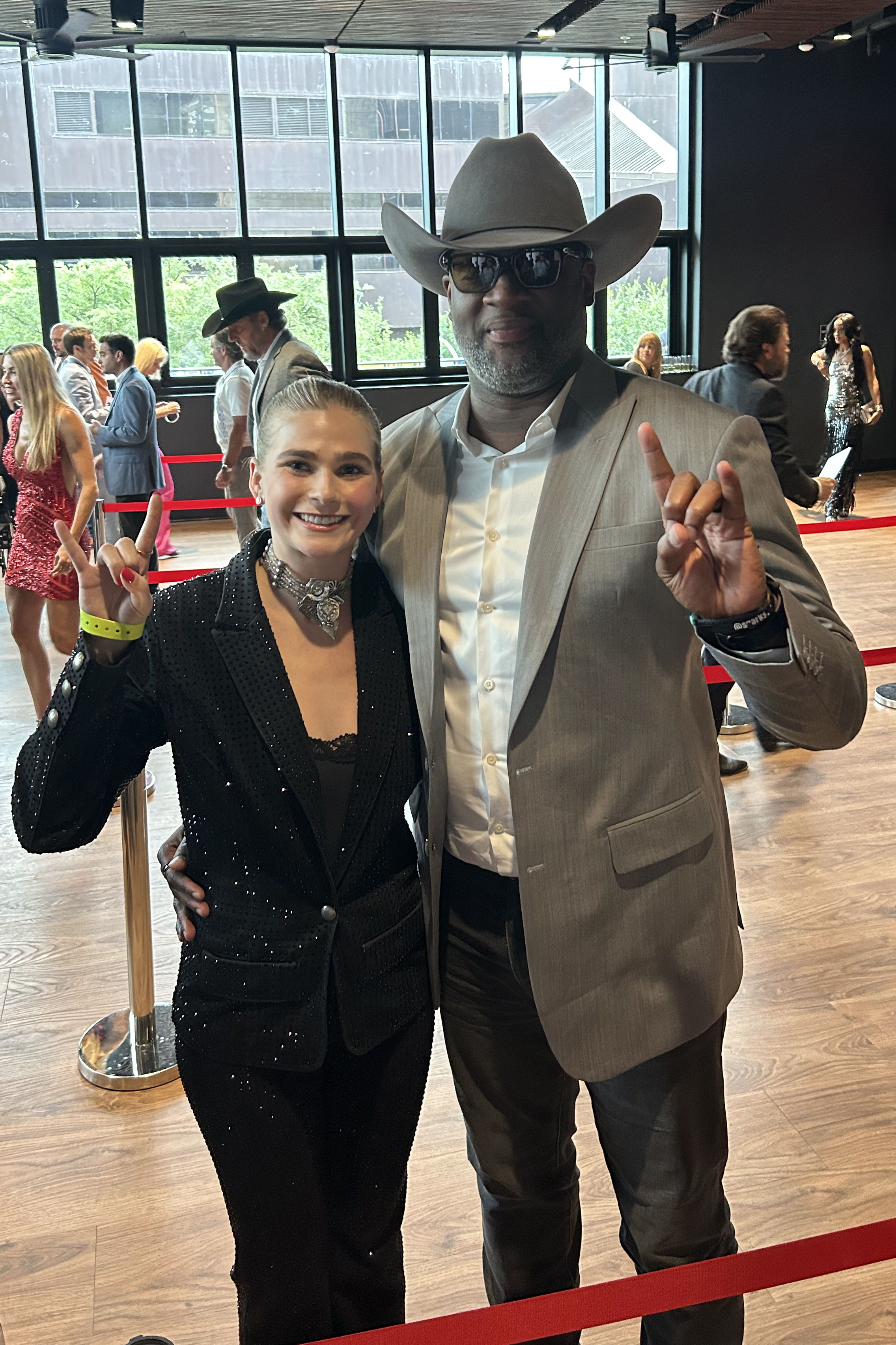 Presley Carter and Vince Young with their horns up! 