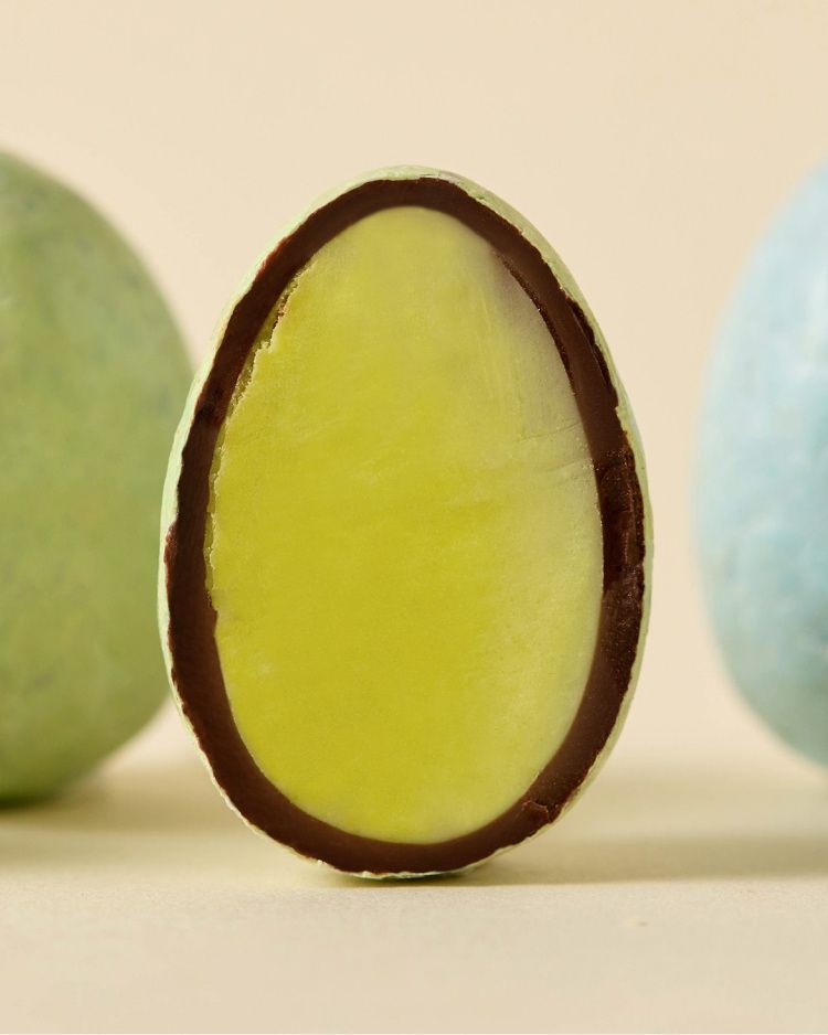 Chocolate-covered candy resembling an egg, with a green filling.