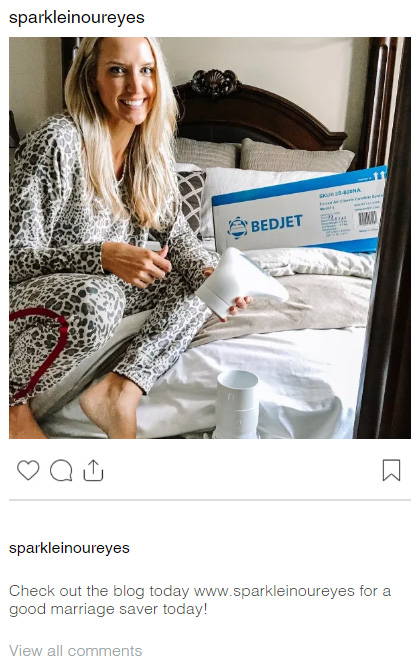 An Instagram post by @sparkleinoureyes of a blonde woman in leopard-print pajamas sitting on a bed holding a BedJet air nozzle