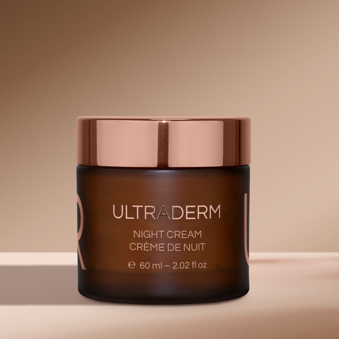 A jar of Ultraderm night cream on a neutral background.