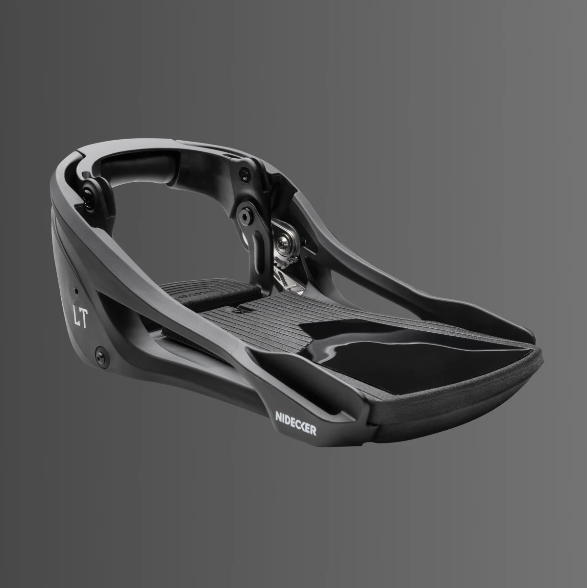 A black ski binding baseplate on a gray background.
