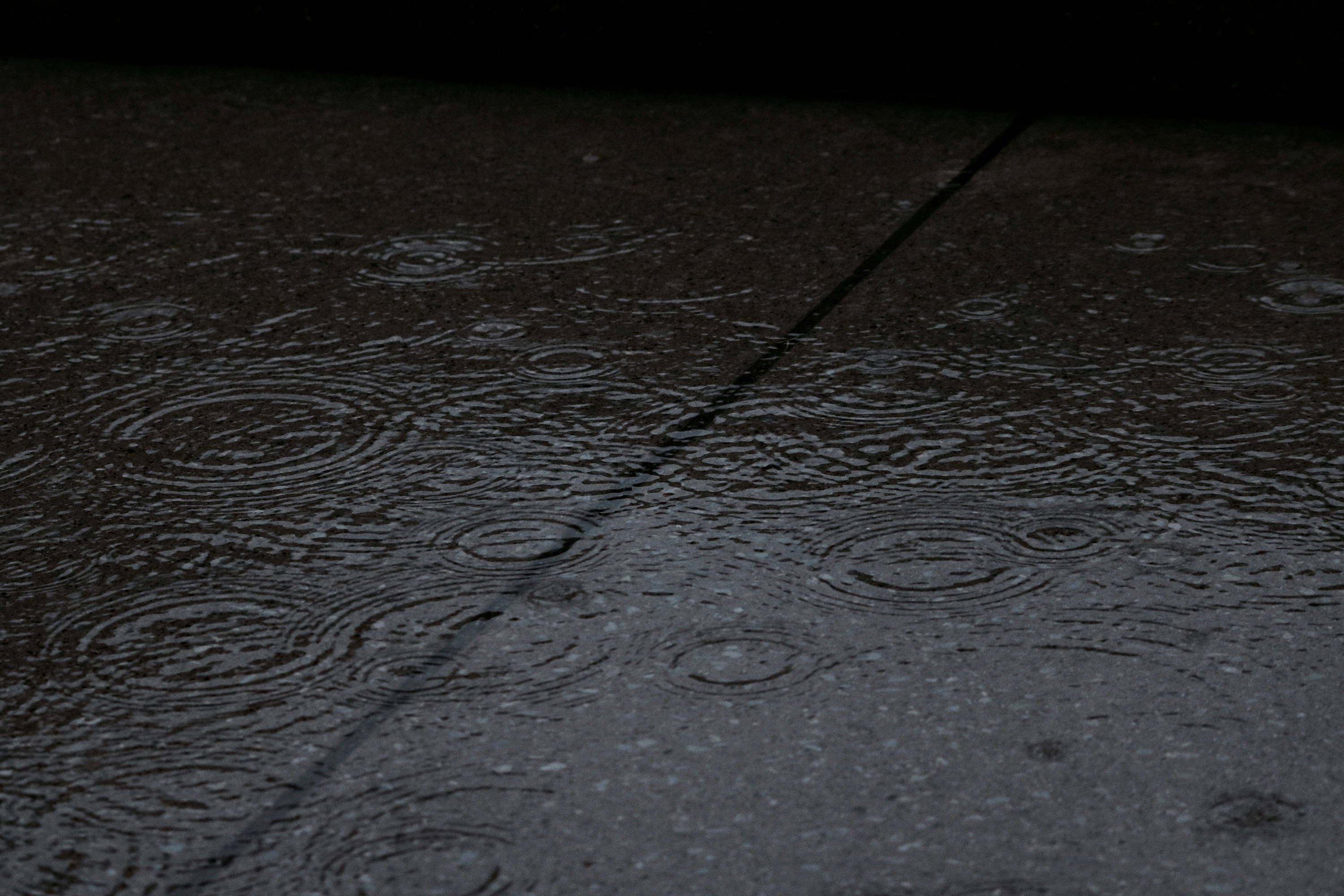 Rain falling on the pavement