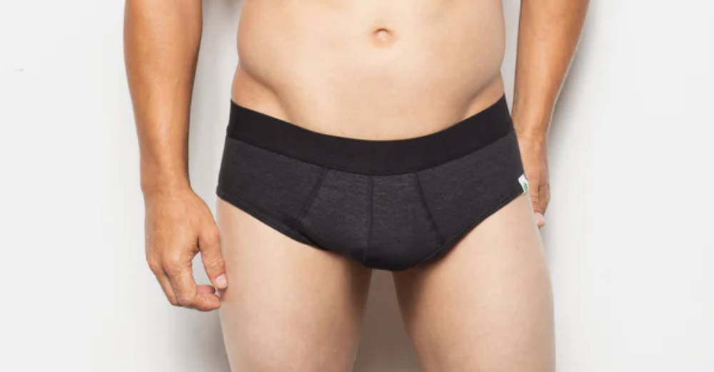 A man stands wearing WAMA hemp briefs.