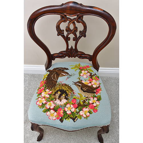 Apple Blossom needlepoint finished as chair cushion