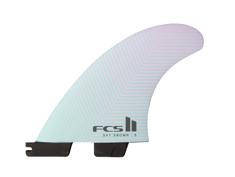 Surfboard fin with FCS logo and gradient design.