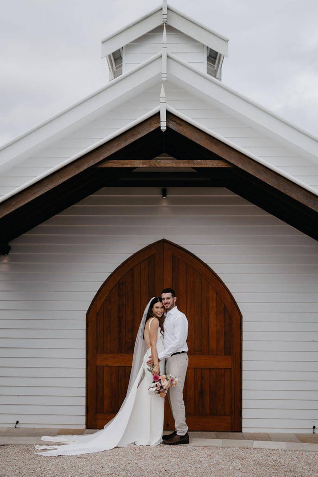 Bride and Groom in front of the Chapelle 