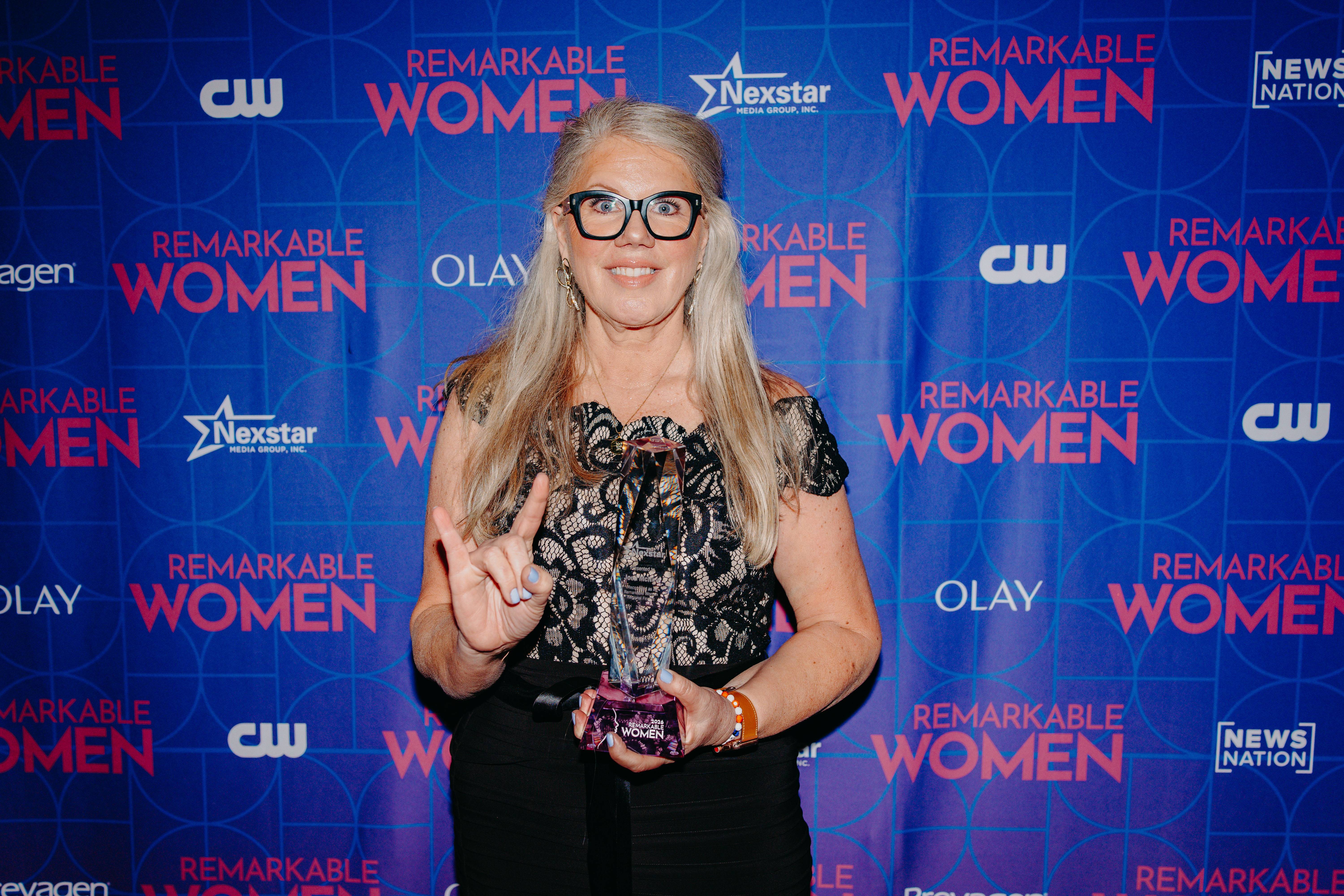 Joell McNew with her Remarkable Women award.