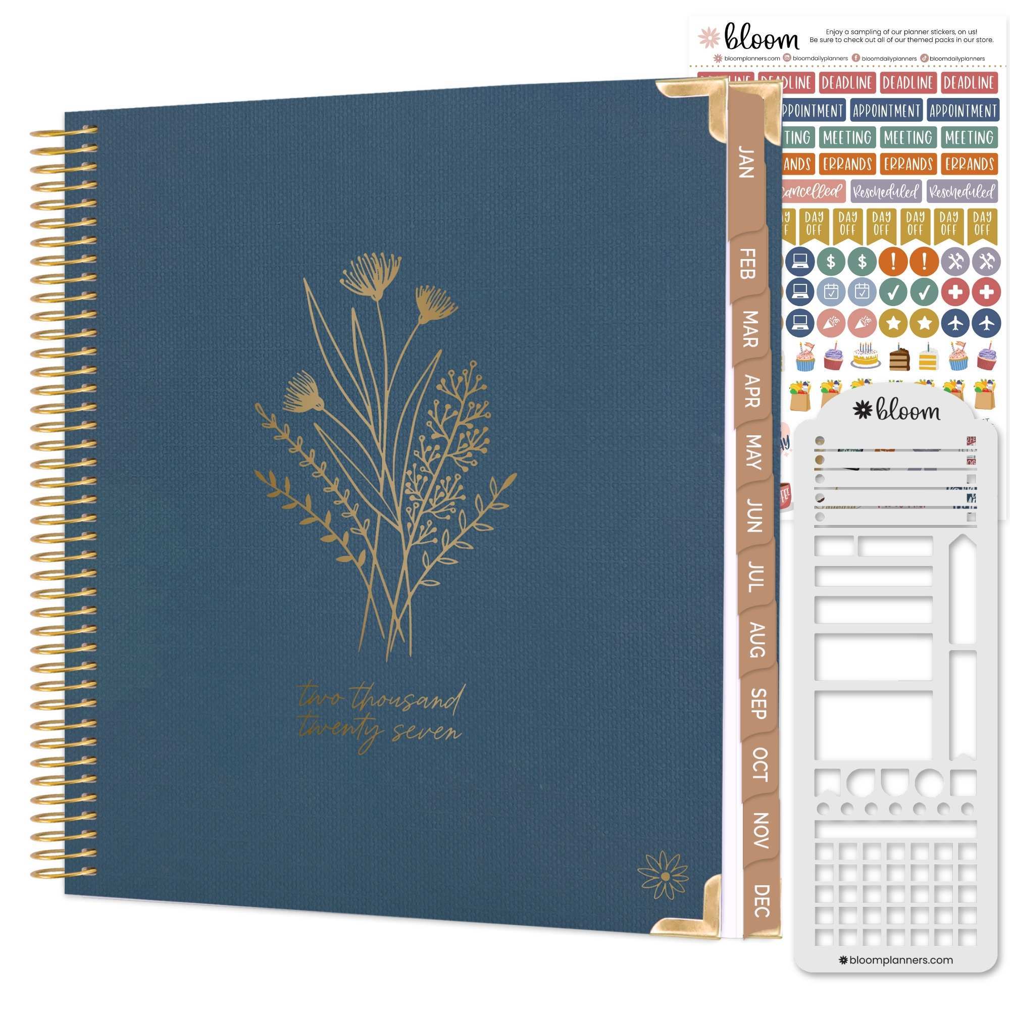 a navy blue linen covered planner with a gold foiled floral stamp on the front and tan monthly tabs on the right hand side