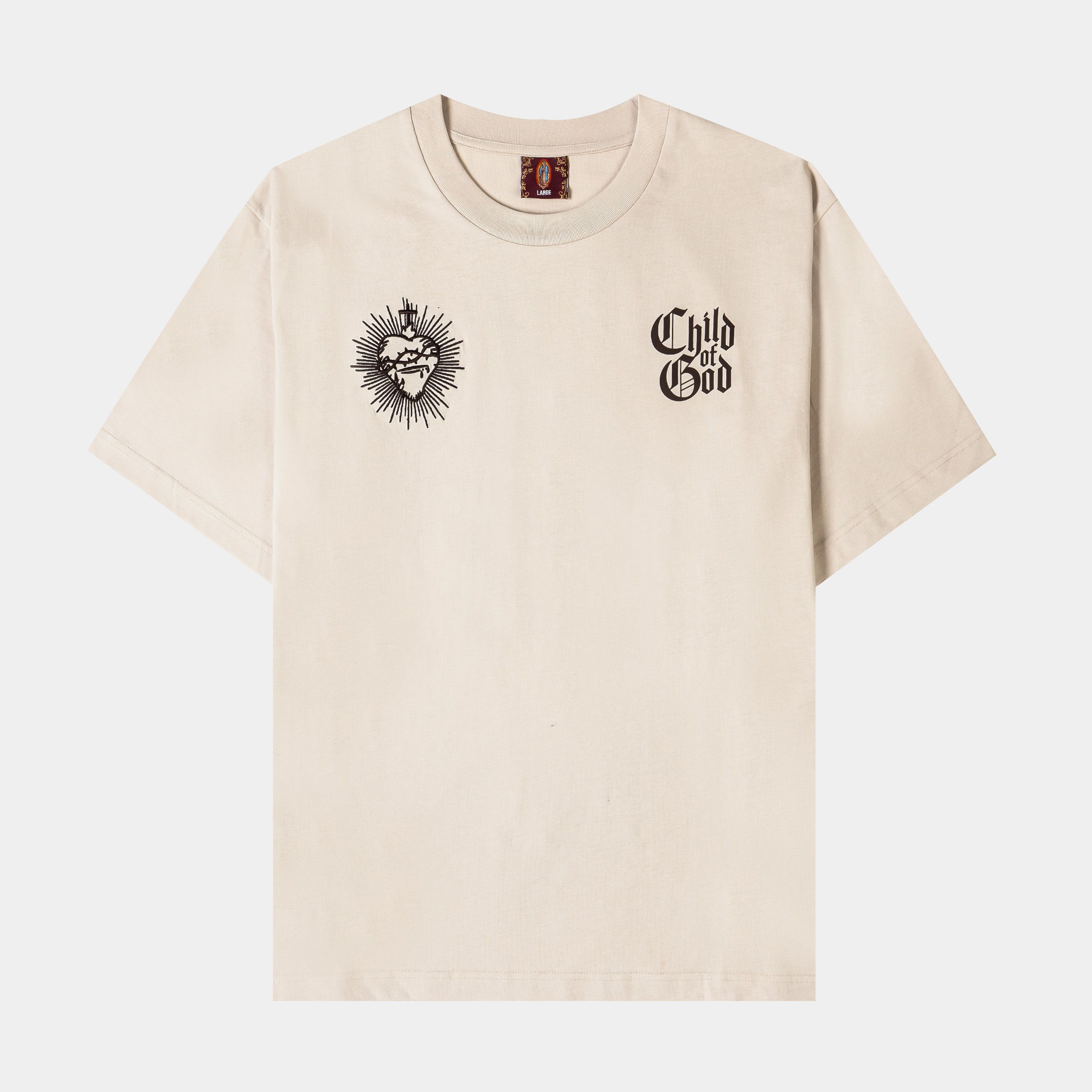 Beige t-shirt with graphic designs on the front.