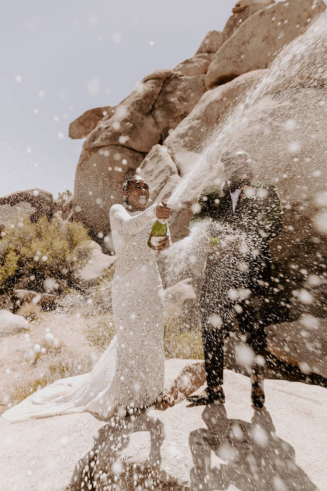 Bride and Groom celebrating with champagne